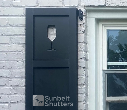 Black composite raised panel shutter with a wine glass cutout