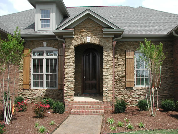 Stained Board and Batten Shutters with Arch Tops 